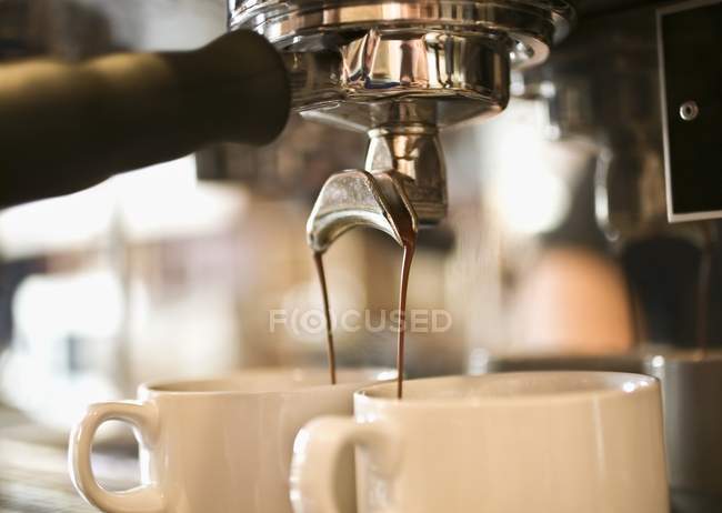 Pouring A Beverage from coffee machine at bar — Stock Photo