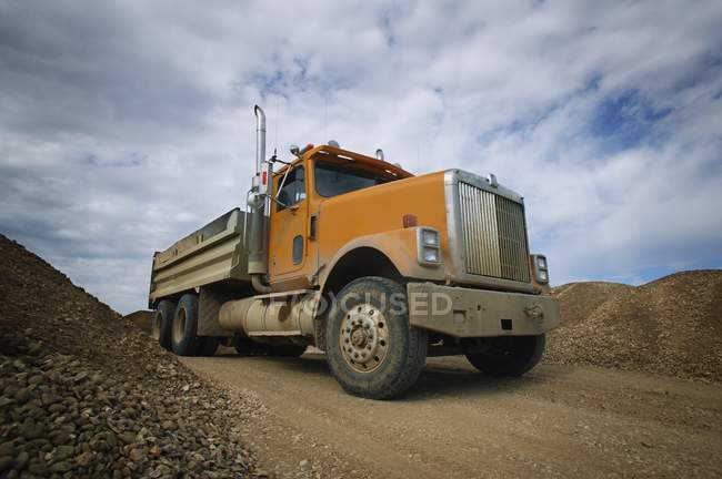 Gravel Truck on dirt road — Stock Photo