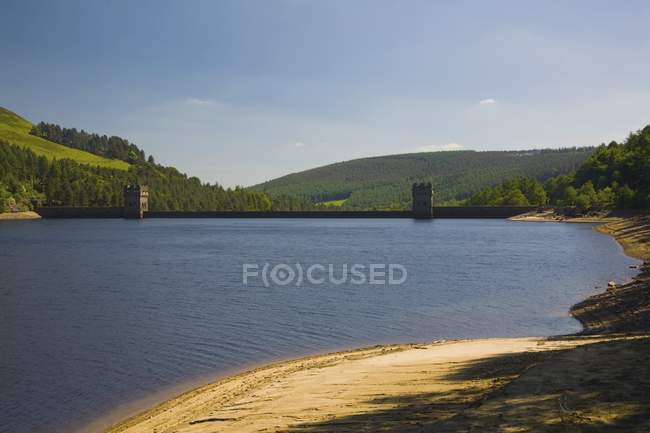 Lake with hills on background — Stock Photo