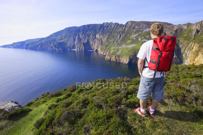 Man with red backpack — Stock Photo