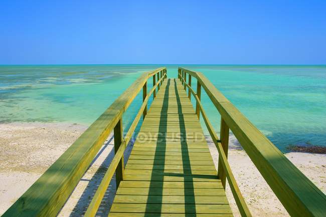 Wooden Pier against water — Stock Photo