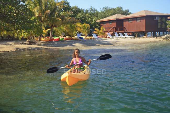 Woman Kayaking in water — Stock Photo