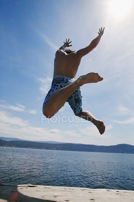 Man with raised arms — Stock Photo
