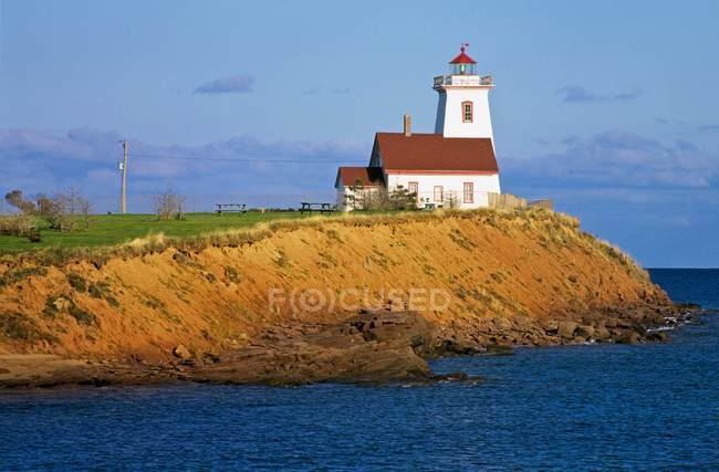 Lighthouse on top of hill — Stock Photo