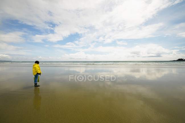 Woman In A Raincoat Looking Out — Stock Photo