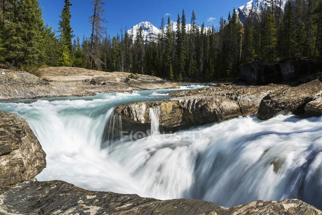 Rushing river with rocky banks — Stock Photo