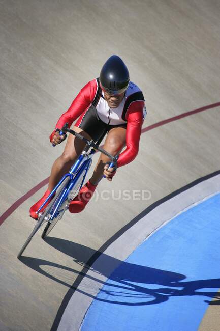 Cyclist in helmet riding bicycle, high angle view — Stock Photo