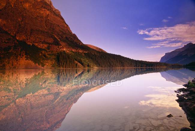 Hills on shore of river — Stock Photo