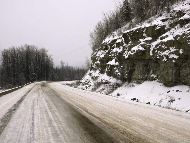 Winter snowy road — Stock Photo