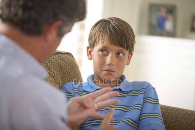 Closeup Of Father Disciplining Son At Home — Stock Photo