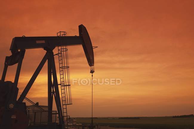Working Pumpjack At Sunset — Stock Photo
