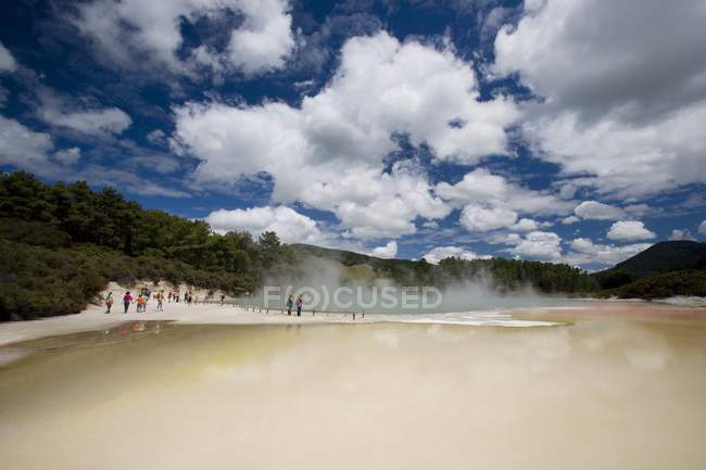 Tourists At Geothermal beach — Stock Photo