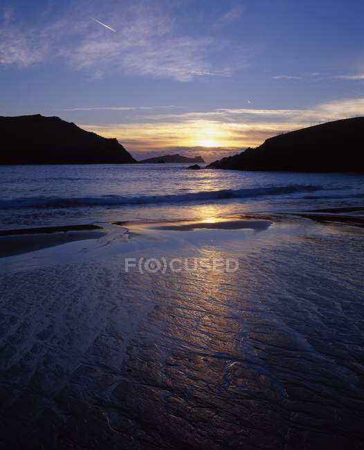 Sunset Over Water with hills — Stock Photo