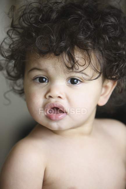 Portrait Of Young Baby Girl With Dark Curly Hair — Stock Photo