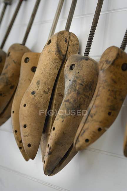 Shoe Molds In A Row against white wall — Stock Photo