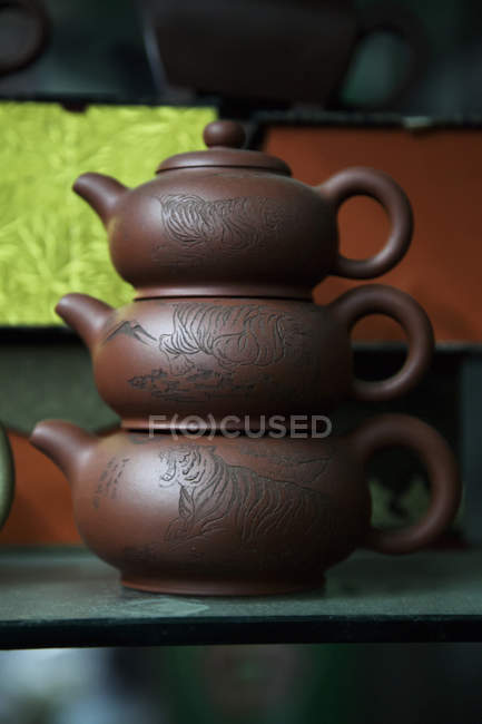 Three stacking chinese teapots — Stock Photo