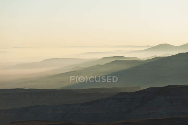 Silhouette of landscape in fog — Stock Photo