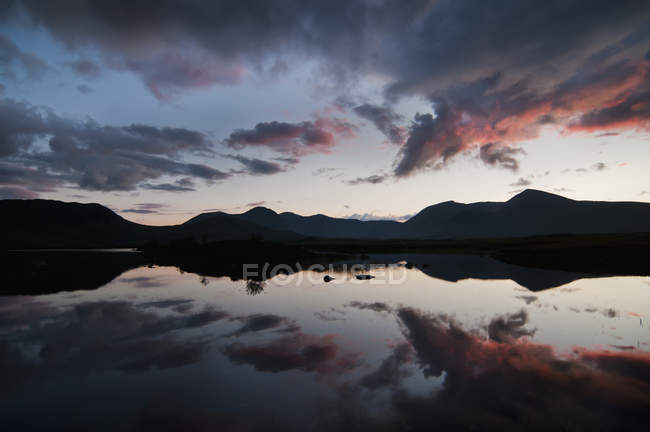 Mirror Image Of Silhouetted Mountains — Stock Photo