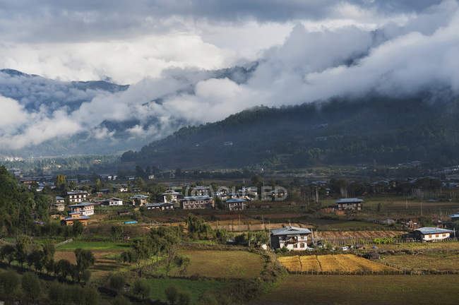 Houses In Valley on foot of mountain — Stock Photo