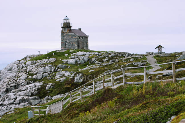 View Of Lighthouse on rocky hill — Stock Photo