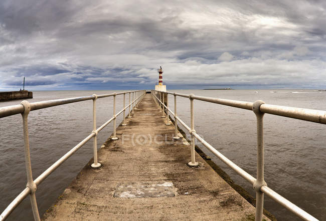 Lighthouse At The End Of Pier — Stock Photo