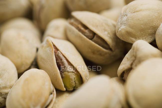 Closeup view of dried pistachio nuts heap — Stock Photo