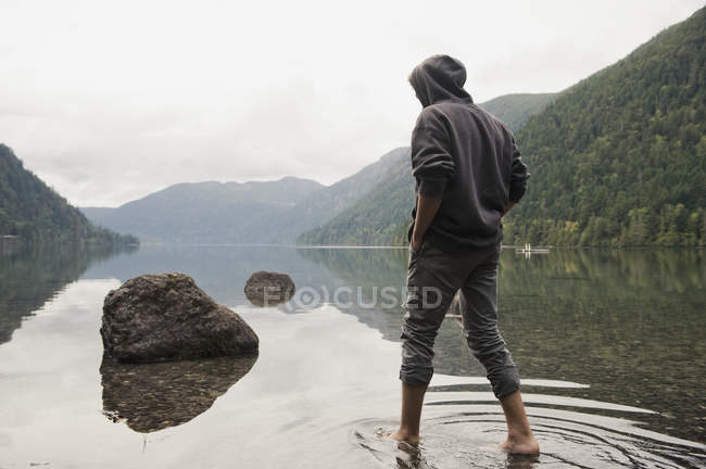 Young Man Wades In Water — Stock Photo