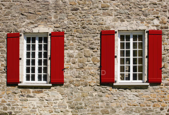Red Shutters On Windows Of Building In Lower Village Old Quebec Red Shutters On Windows Of Building In Lower Village Old Quebec City