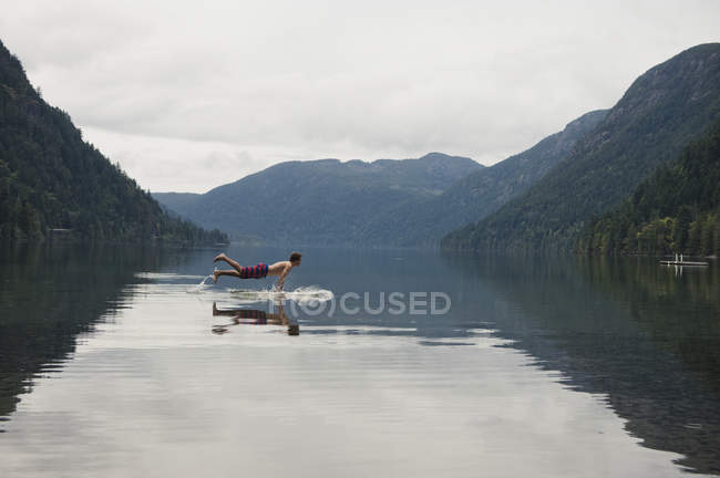 Young Man In Cameron Lake — Stock Photo
