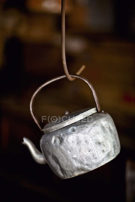 An Old Aluminum Teakettle Hangs On A Steel Hook In Easy Reach; George Town Penang Malaysia — Stock Photo