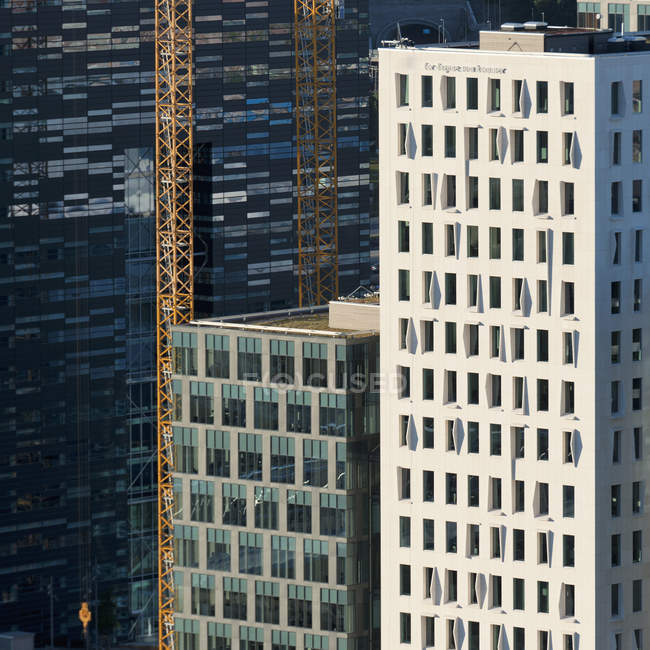 Cranes Beside Building — стоковое фото