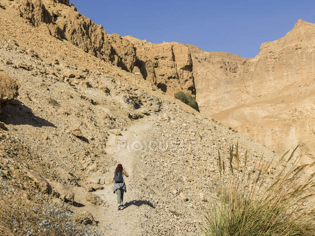 Young woman walks on trail — Stock Photo