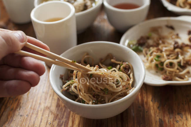 Person eating Spicy noodles, — Stock Photo