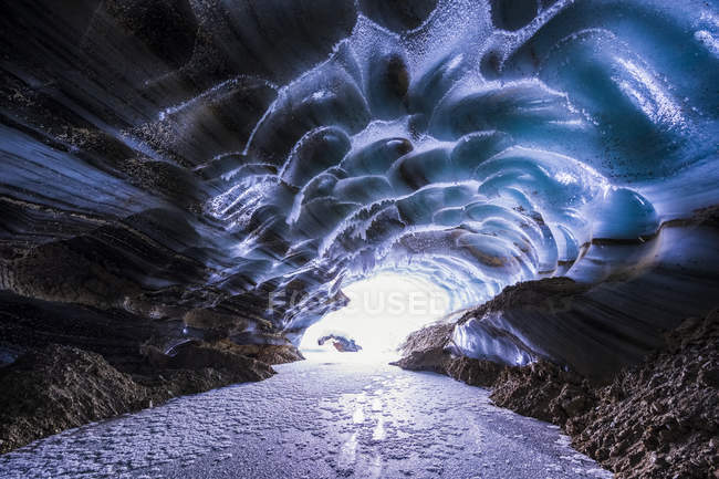 Ice cave with light — Stock Photo