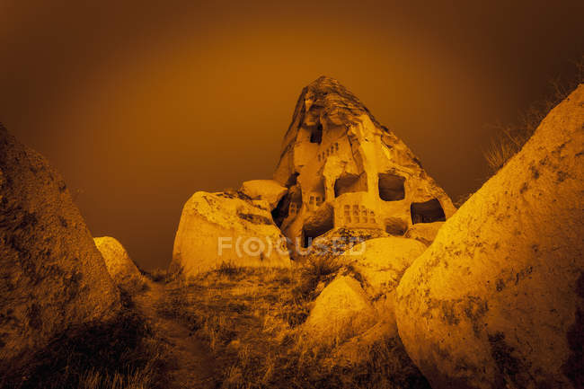 Cave homes in rock formations — Stock Photo
