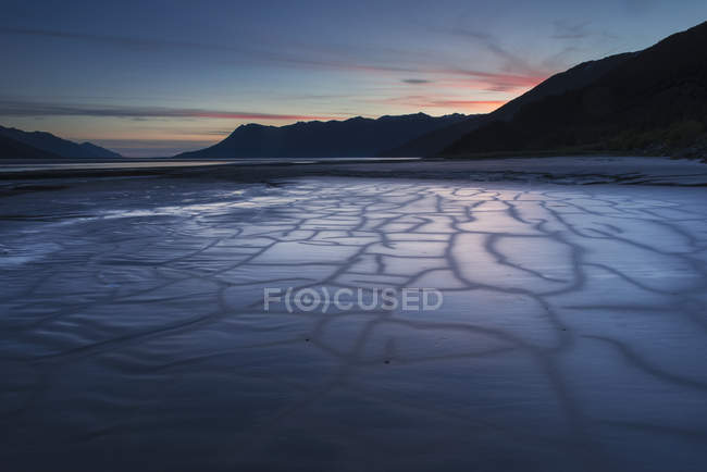Patterns in the mudflats at dusk — Stock Photo