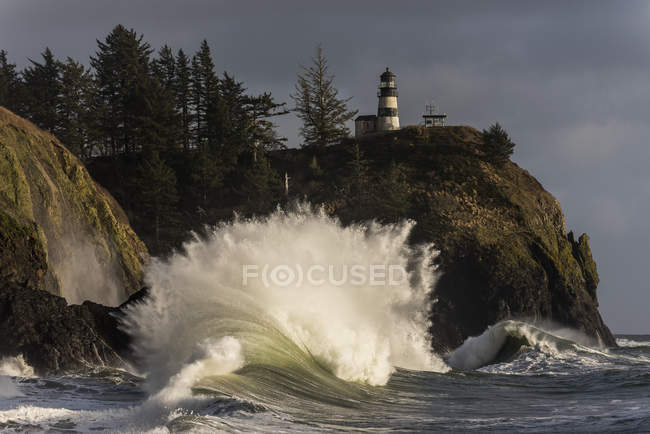 Wave explodes at Cape Disappointment — Stock Photo