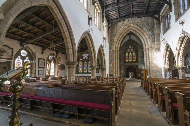 Wooden pews and arches — Stock Photo