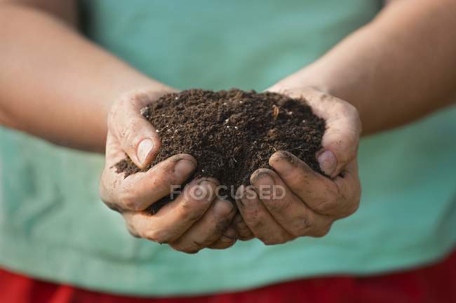 Midsection of Handful Of Soil  during daytime — Stock Photo