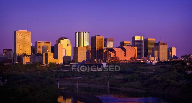 City against river At Twilight — Stock Photo