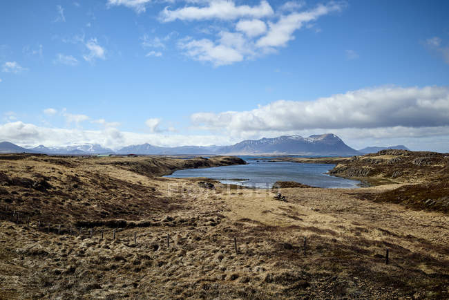 Brown Landscape Along The Coast With Mountain Peaks In The Distance, Snaefellsnes Peninsula; Iceland — Stock Photo