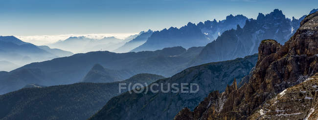 Panorama of silhouetted rugged mountain range; Sesto, Bolzano, Italy — Stock Photo