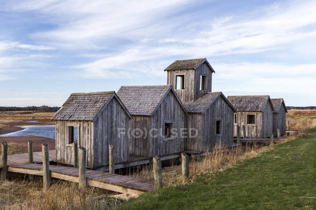 Natural wooden structures on a boardwalk on a beach along the coast; Prince Edward Island, Canada — Stock Photo