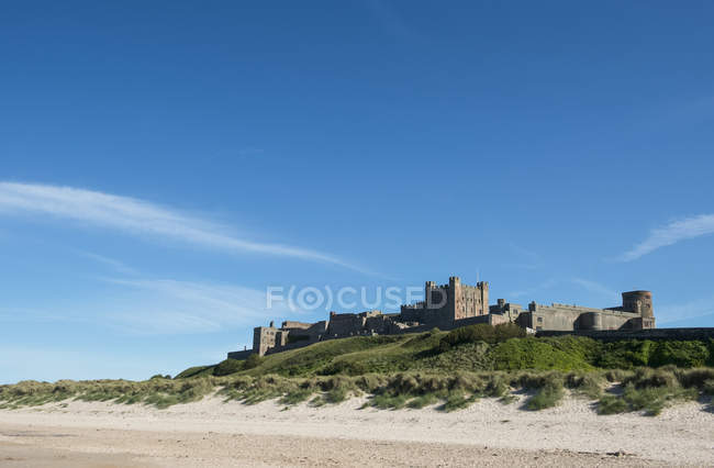 Scenic view of famous Bamburgh Castle from sea, Bamburgh, Northumberland, England — Stock Photo