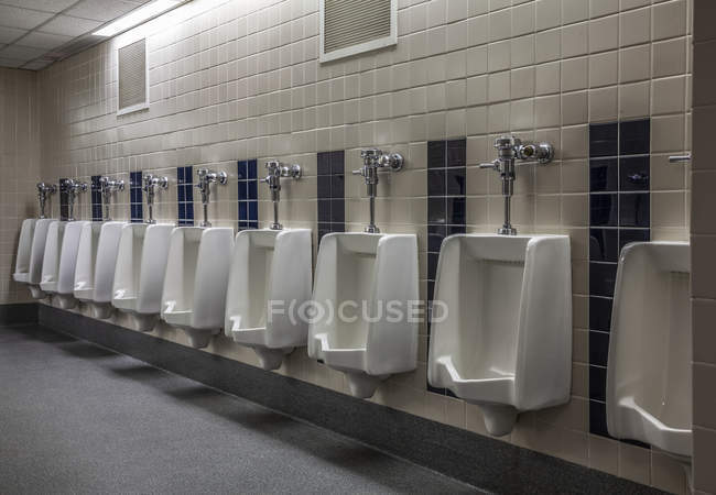 Urinals in a gymnasium bathroom; Connecticut, United States of America — Stock Photo