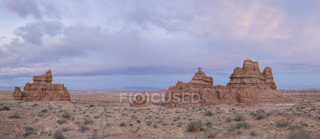 Rock formations at sunrise in Goblin Valley State Park along Highway 24, stitched panorama; Hanksville, Utah, United States of America — Stock Photo