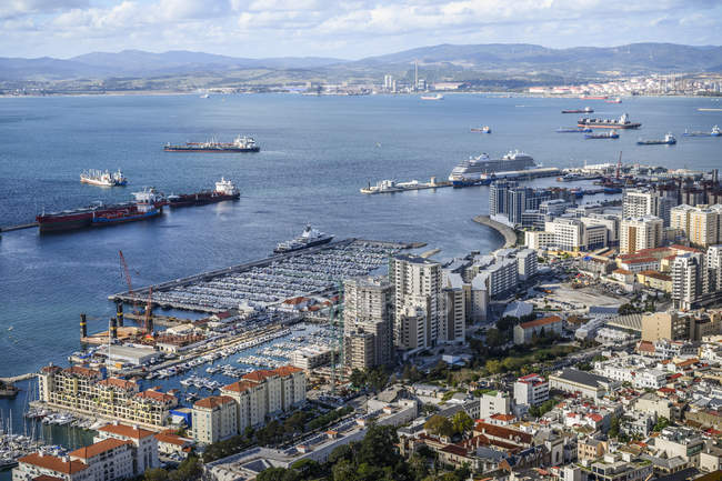 Ships in the harbour and a view of the coastline of Gibraltar; Gibraltar — Stock Photo