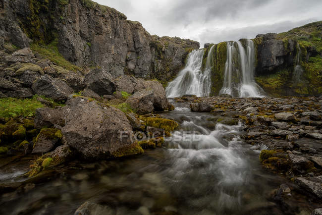 Waterfall along the road on the West Fjords; West Fjords, Iceland — Stock Photo