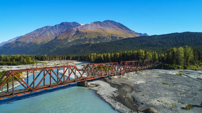 High angle view of the Alaskan Railroad trestle crossing the Snow River on a sunny summer day in South-central Alaska, Alaska, United States of America — Stock Photo