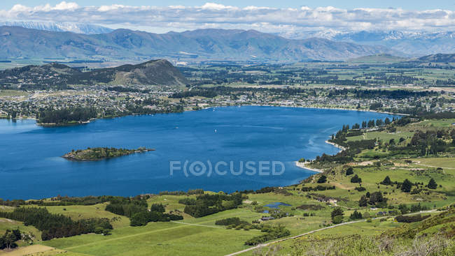 Beautiful view of Wanaka Lake and town along a Roys Peak Track; Wanaka, South Island, New Zealand — Stock Photo